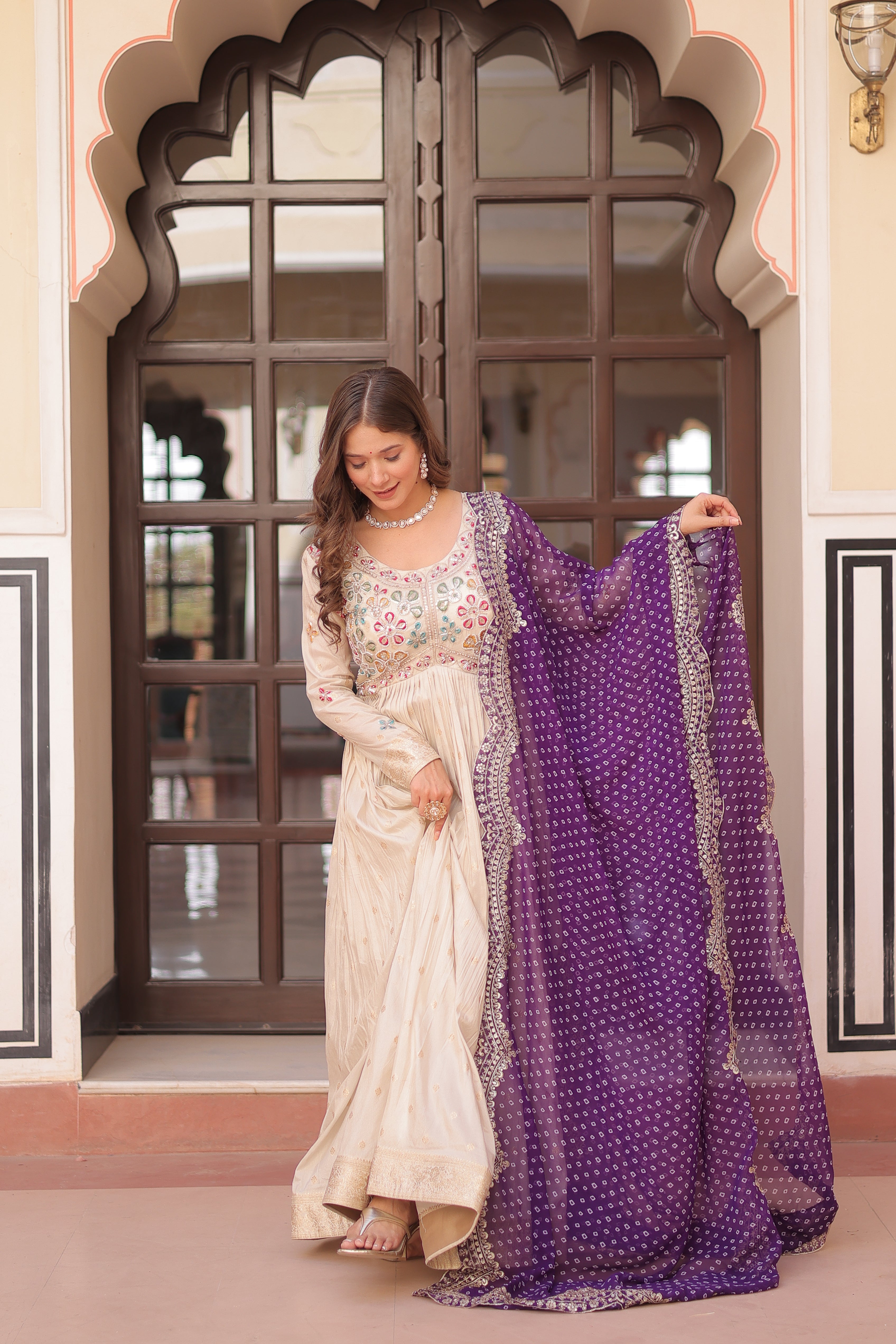 *Experience the allure of Trending Cosmos Jequard Gown With Bandhani Printed Embroidered Cut work Dupatta. Discover the perfect fusion of elegance and grace. Shop now for a timeless appearance.*